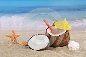 Coconut fruit cocktail drink in summer on the beach and sea