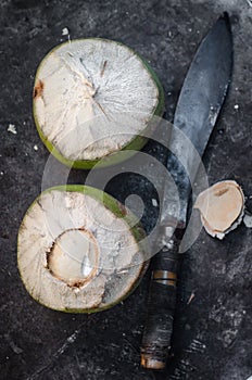 Coconut fruit with knife