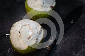 Coconut fruit with knife