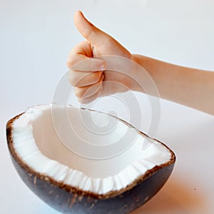 Coconut. Half of coconut and hands isolated on white background