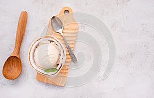 Coconut ice cream flavours in half of coconut setup on white stone background. Summer and Sweet menu concept