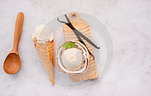 Coconut ice cream flavours in half of coconut setup on white stone background. Summer and Sweet menu concept