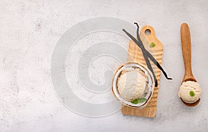 Coconut ice cream flavours in half of coconut setup on white stone background. Summer and Sweet menu concept