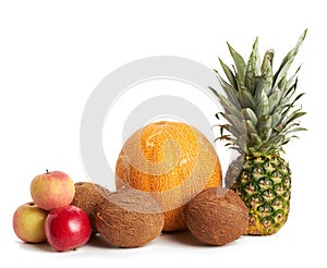 Coconut, melon, apple and fresh whole pineapple isolated on white background, healthy fruits