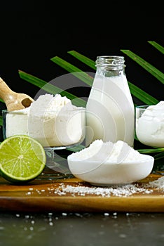Coconut milk, cream, yoghurt, flour, shredded desiccated coconut and oil. photo