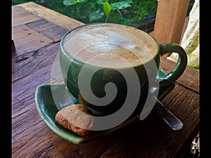 Coconut milk Latte with a heart Cookie