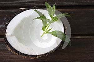 Coconut with mint on the table