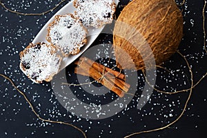 Coconut muffins on a black background
