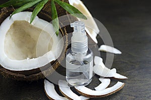 Coconut oil for the face. Cosmetic product in a bottle with a dispenser