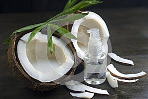 Coconut oil for the face. Cosmetic product in a bottle with a dispenser