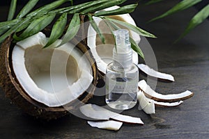 Coconut oil for the face. Cosmetic product in a bottle with a dispenser