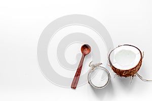 Coconut oil on white background top view copyspace