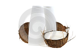 Coconut oil. White bottles mockup and coconuts set with palm green leaf isolated on white background. Organic natural