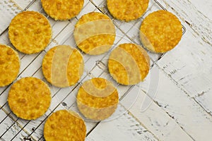 Coconut Orange Biscuit Cake Cut Outs on Cooling Net