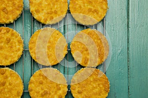 Coconut Orange Biscuit Cake Cut Outs on Cooling Net