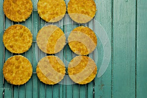 Coconut Orange Biscuit Cake Cut Outs on Cooling Net