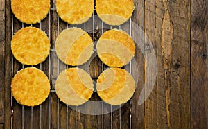 Coconut Orange Biscuit Cake Cut Outs on Cooling Net