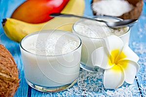 Coconut panna cotta, delicious creamy dessert in a glass in a hawaiian style