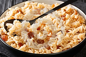 Coconut Rice With Raisins Arroz con Coco close up in the bowl. Horizontal photo