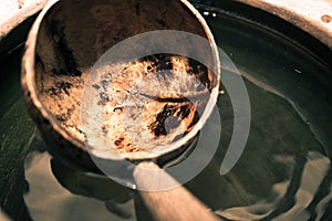 Coconut shell dipper with water jar