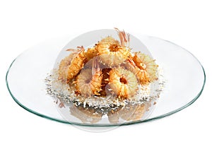 Coconut Shrimp with a crispy breadcrumb and coconut coating served on a transparent glass plate photo