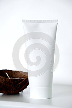 Coconut skin care cosmetic. Advertising poster, cream tube and coconut candle