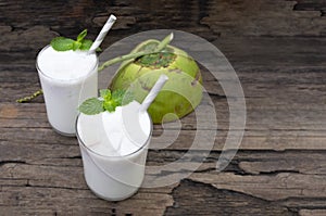 Coconut smoothie drink white fresh cocktail shake milkshake vanilla juice fruit beverage food healthy .