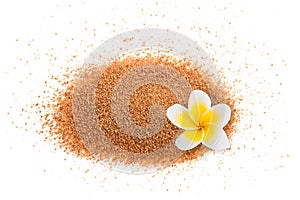 Coconut sugar with plumeria flower photo