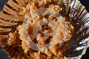 Coconut sweet - prepared with grated coconut and jaggery in low flame