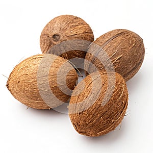 Coconuts with brown husks isolated on white photo