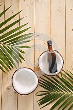 Coconuts and coconut oil on wooden background