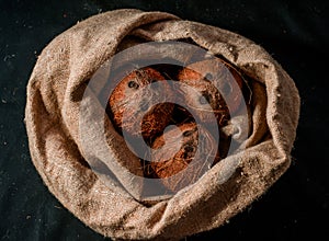 Coconuts, naturally burlap and fresh from the tree photo