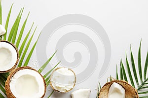 Coconuts products - mct butter, oil, milk, oil, shavings on grey background. Copy space. Hair, skin and body treatment concept