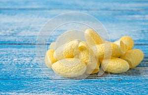 Cocoon , Silk on Blue wooden.