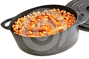 Cocotte on a white background with cassoulet