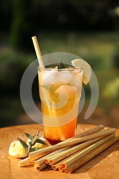 Coctail with bamboo reed straws