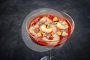 Coctel de gambas, Mexican shrimp cocktail with avocado, close-up photo