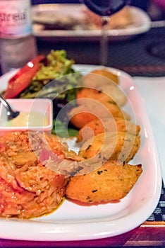 Cod cakes served in a restaurant in Lisbon, Portugal