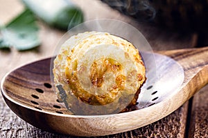 cod dumplings, fish meat dumpling in a slotted spoon, fried salty, macro photography