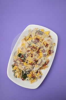 cod fish with corn bread, spinach and beans on dish