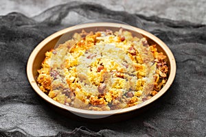 cod fish with corn bread, spinach and beans on dish