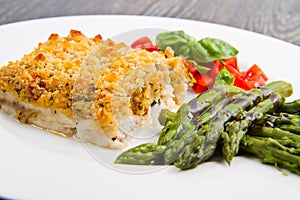 Cod fish with crispy breadcrumbs and asparagus