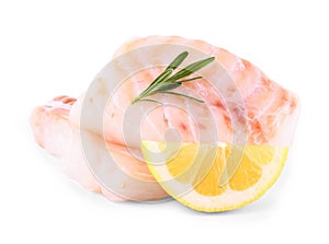 Cod fish fillet with lemon, rosemary on white