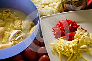 Cod fish with rice, paprika, tomatoes