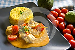 Cod fish with rice, paprika, tomatoes