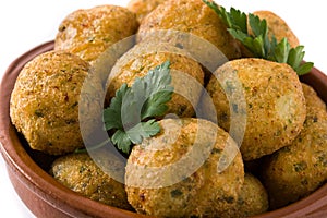 Cod fritters in crock pot isolated