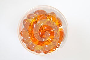 Cod liver oil capsules in container