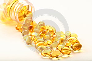 Cod liver oil capsules- on white background.