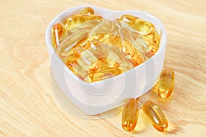 Cod Liver Oil Capsules in white cup