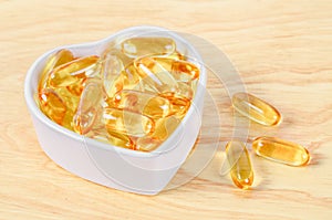 Cod Liver Oil Capsules in white cup